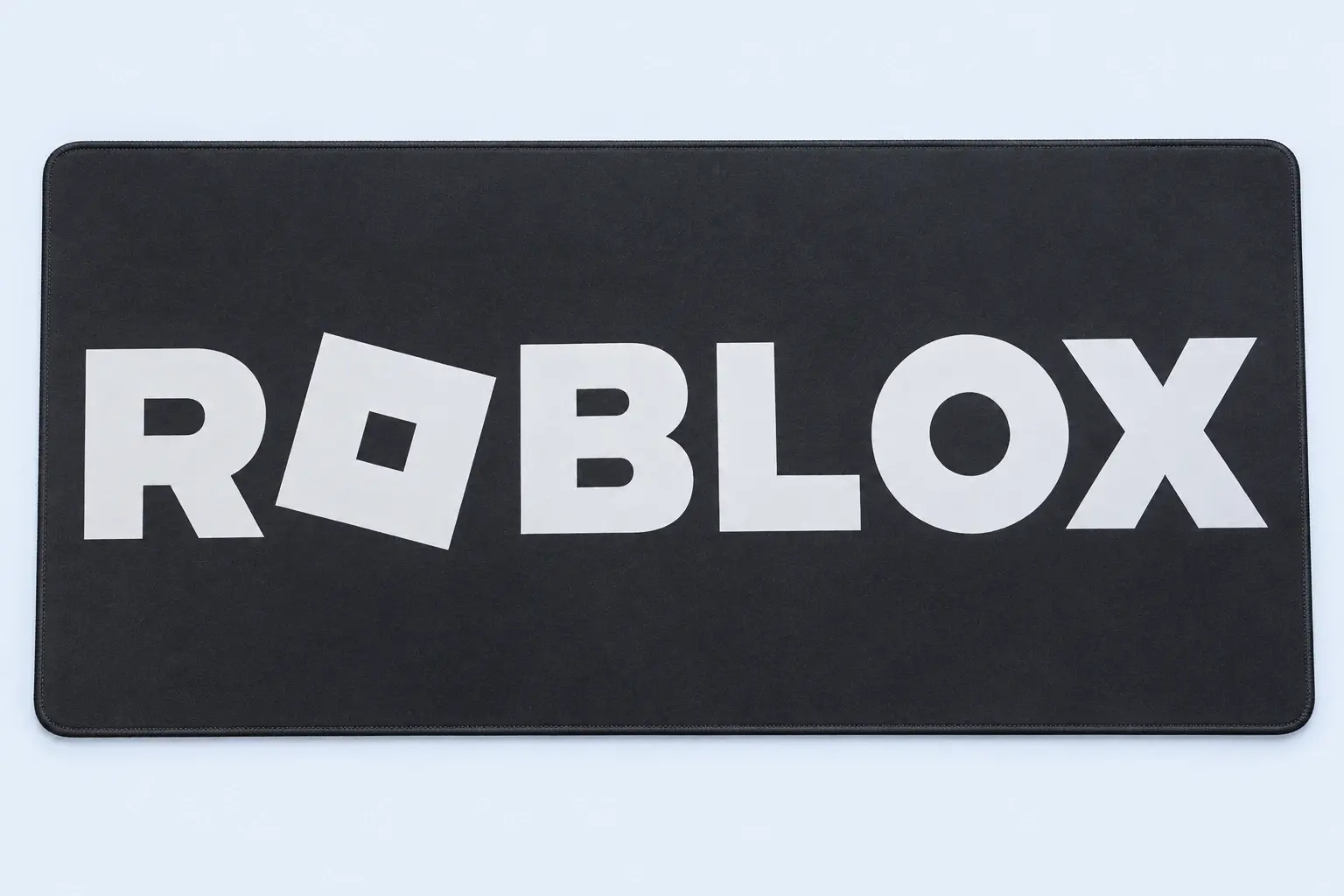 Cloud Blue studio presentation of Black Roblox Logo Deskmat.